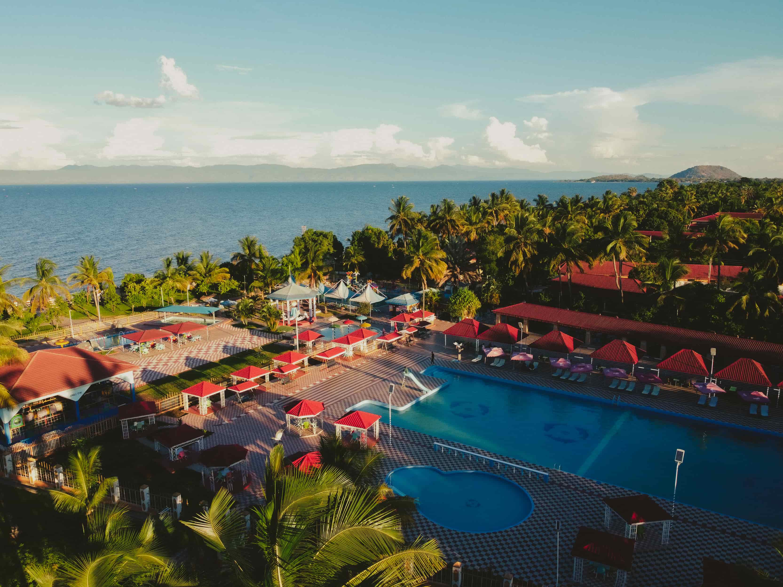 Aerial view of Sun 'n' Sand Holiday Resort with its swimming pools, palm-lined grounds and resort buildings